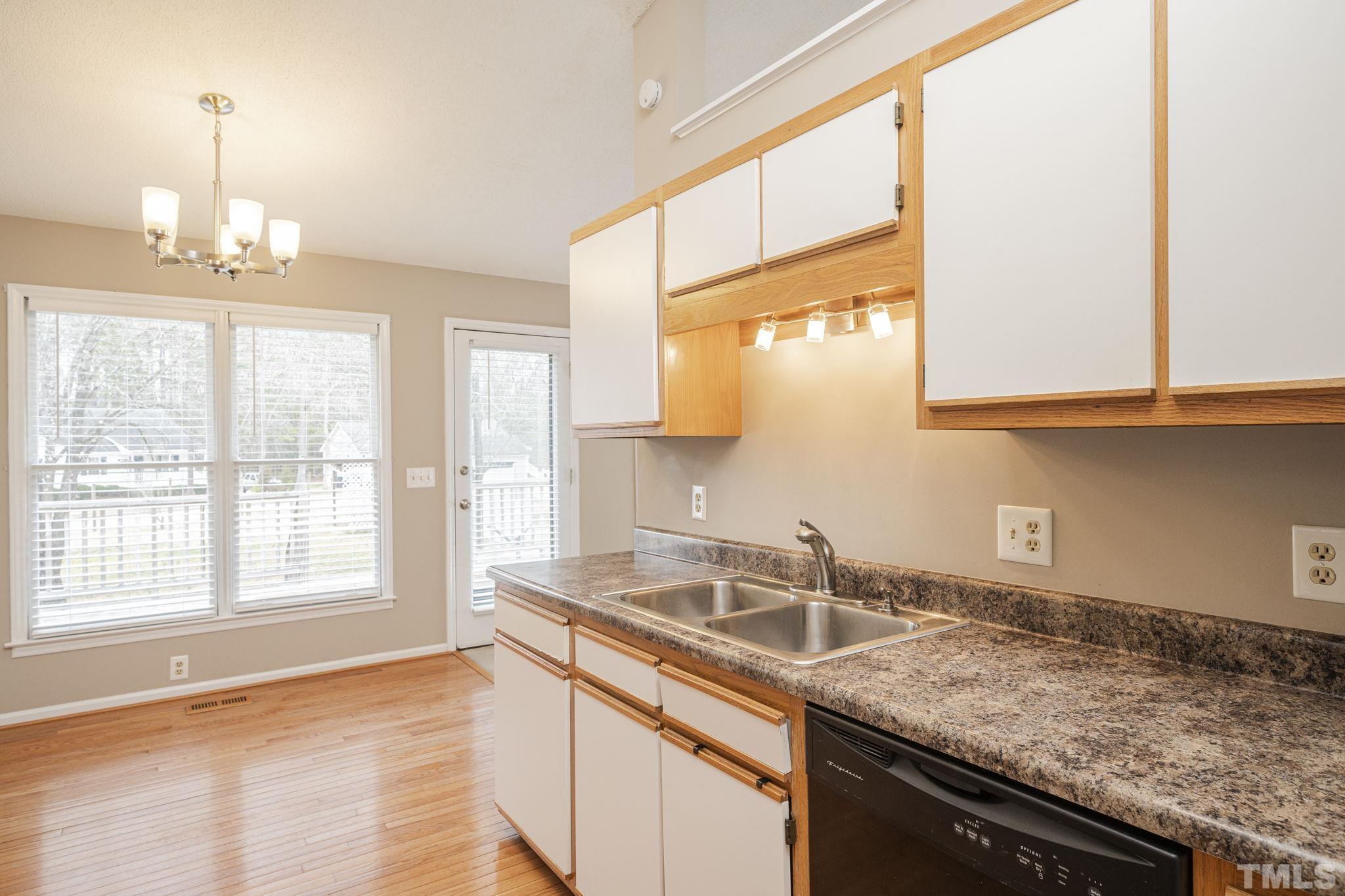 105 Pineview Drive Zebulon, NC 27597 - Photo 13 of 29 a kitchen with a sink and a window