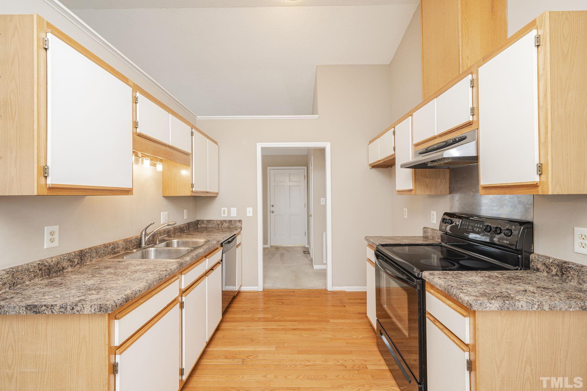 105 Pineview Drive Zebulon, NC 27597 - Photo 14 of 29 a kitchen with stainless steel appliances granite countertop a sink stove and refrigerator