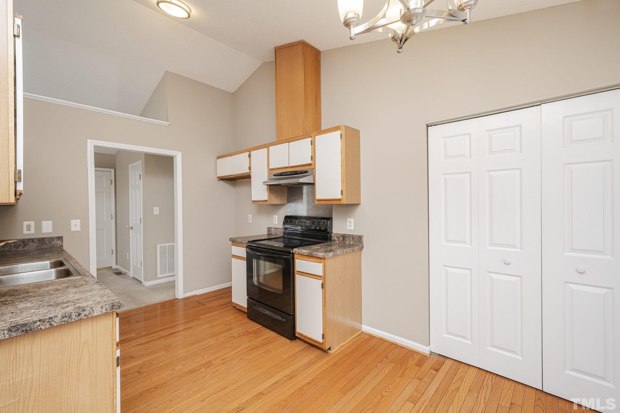 105 Pineview Drive Zebulon, NC 27597 - Photo 15 of 29 a kitchen with stainless steel appliances granite countertop a stove and a sink
