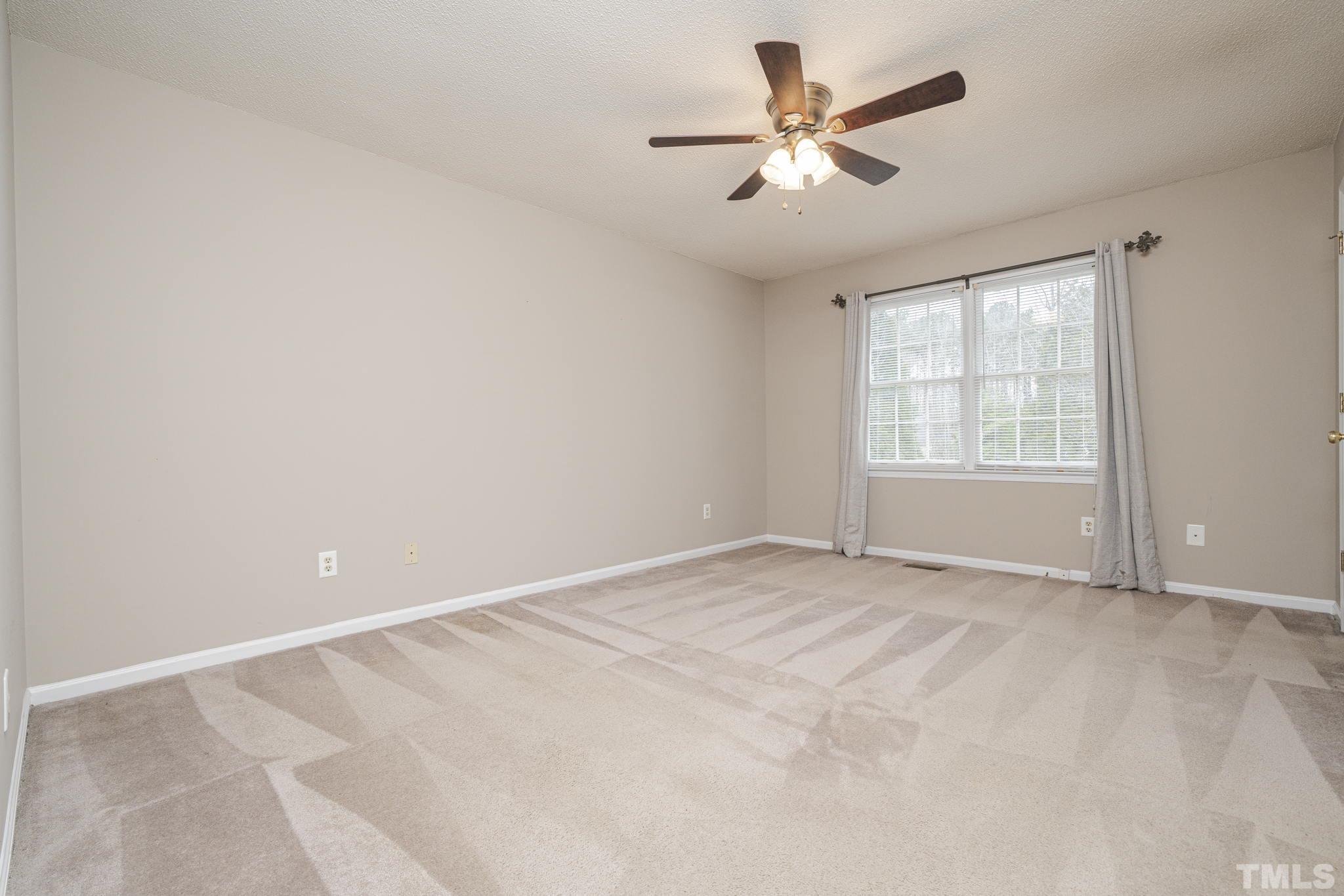 105 Pineview Drive Zebulon, NC 27597 - Photo 16 of 29 a view of an empty room with a window