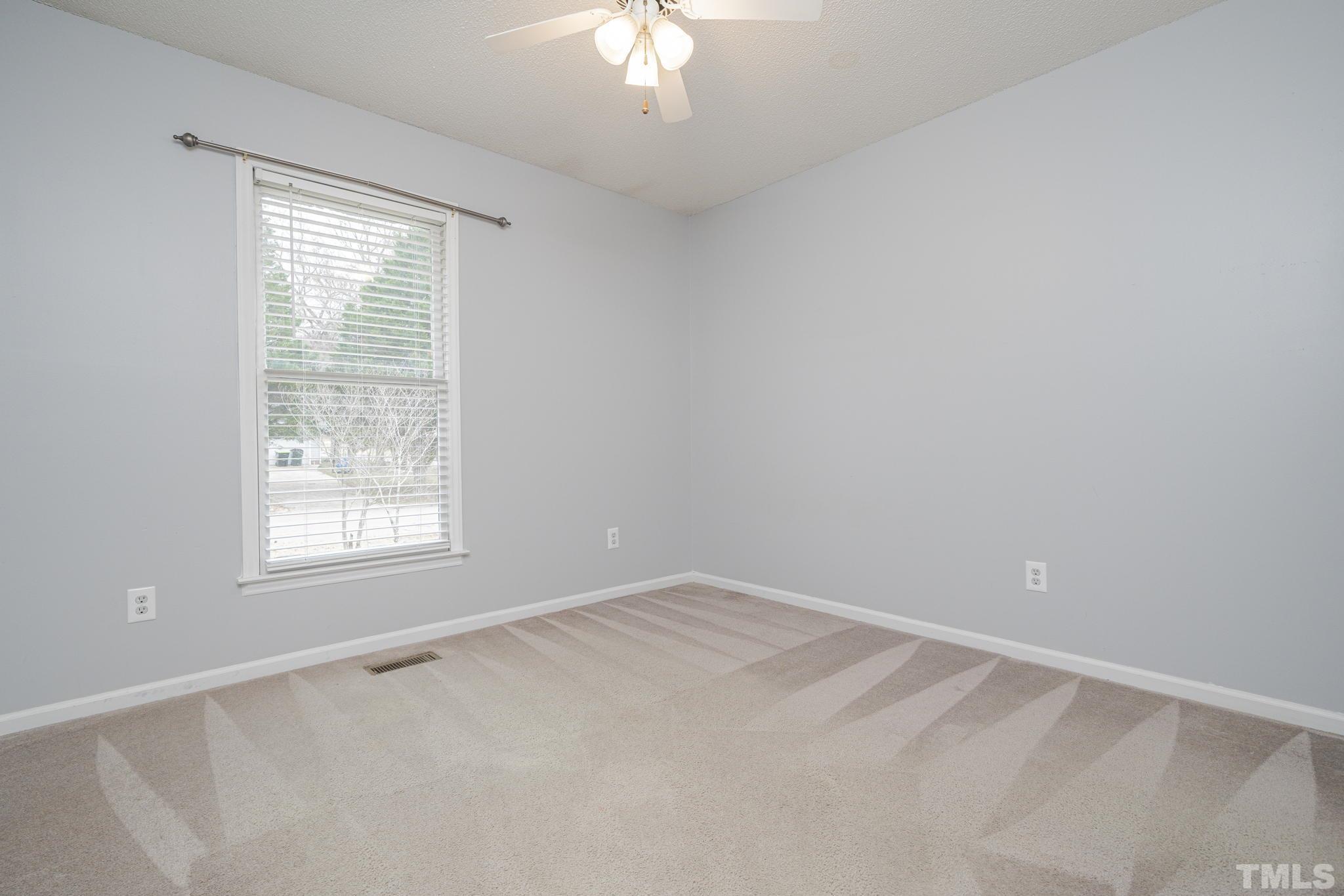 105 Pineview Drive Zebulon, NC 27597 - Photo 21 of 29 an empty room with a window