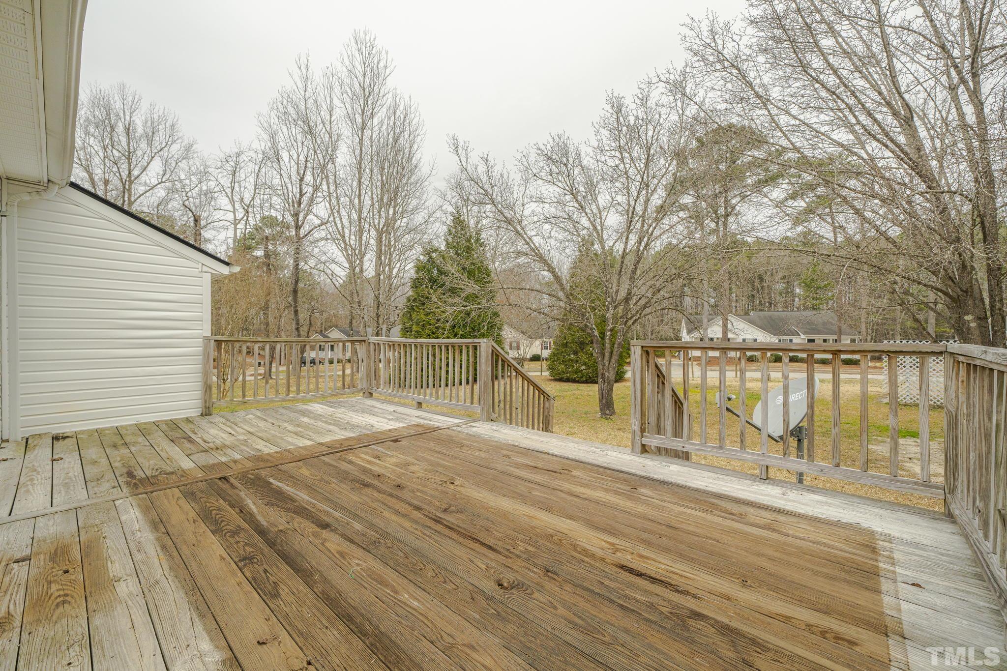 105 Pineview Drive Zebulon, NC 27597 - Photo 22 of 29 a view of backyard with wooden floor and fence
