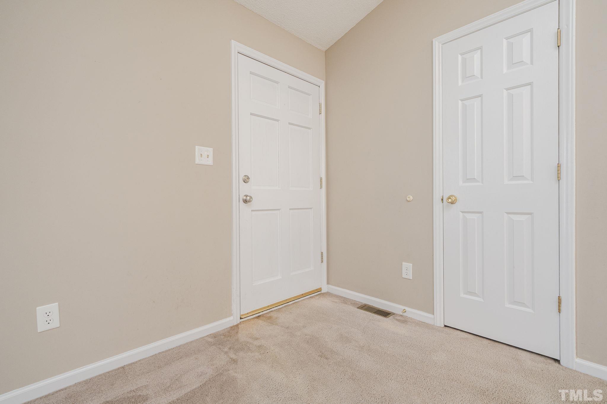 105 Pineview Drive Zebulon, NC 27597 - Photo 6 of 29 an empty room with windows