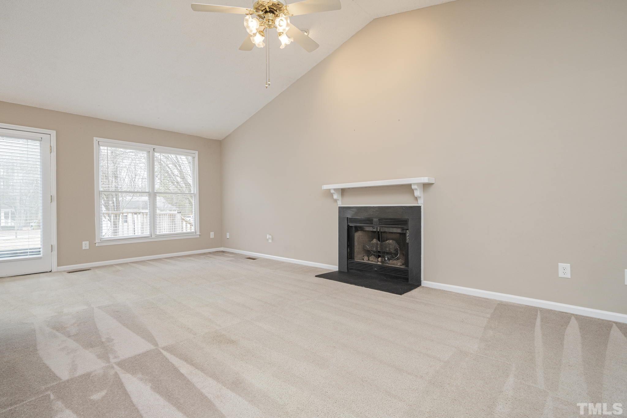 105 Pineview Drive Zebulon, NC 27597 - Photo 8 of 29 a view of an empty room with a fireplace