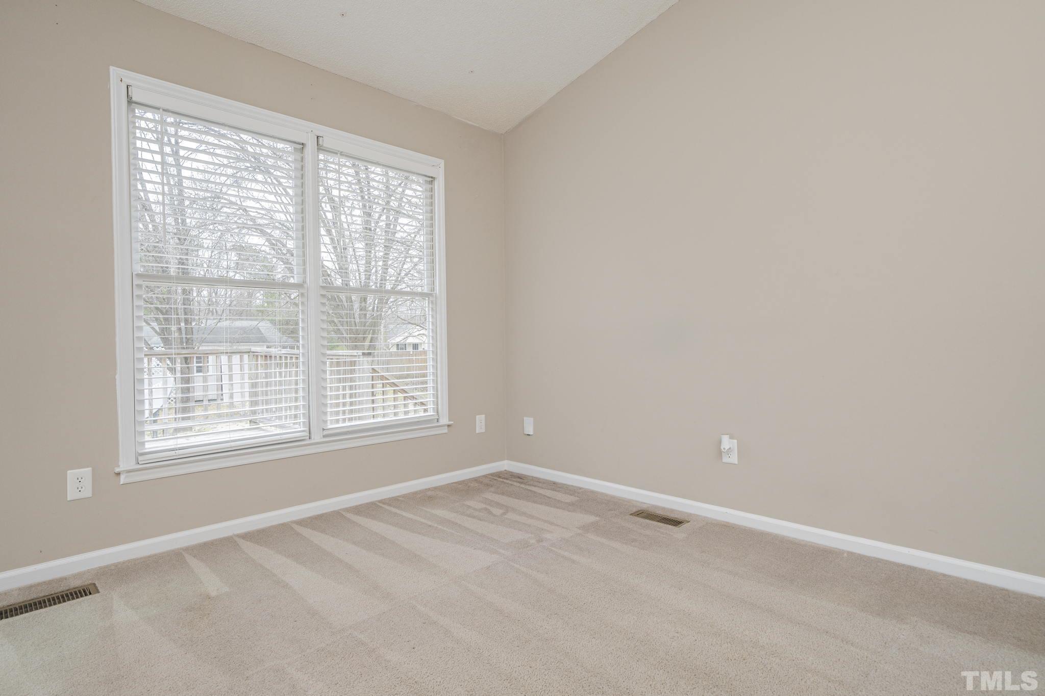 105 Pineview Drive Zebulon, NC 27597 - Photo 9 of 29 a view of an empty room with a window