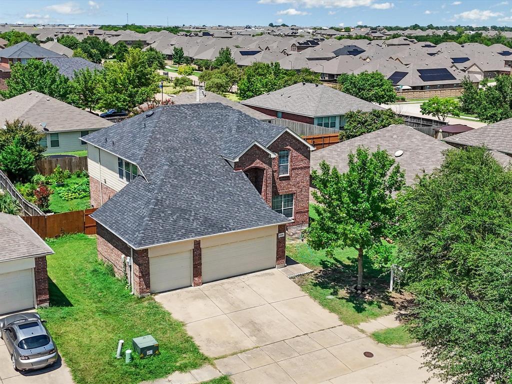 2009 Cooper Ridge Lane Heartland, TX 75126 - Photo 28 of 40 an aerial view of a house with a yard and lake view