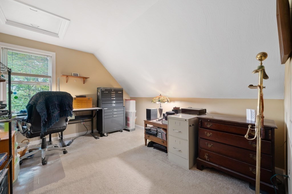 235 Curtis Farm Road Wilton, NH 03086 - Photo 23 of 34 a view of a workspace with furniture and a window