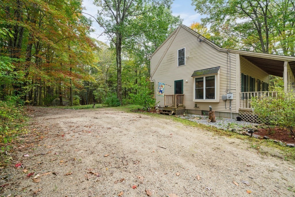 235 Curtis Farm Road Wilton, NH 03086 - Photo 25 of 34 a house with a yard