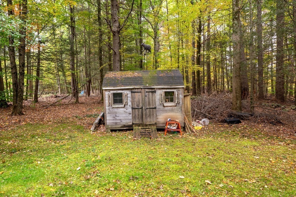 235 Curtis Farm Road Wilton, NH 03086 - Photo 26 of 34 a view of a house with backyard and trees