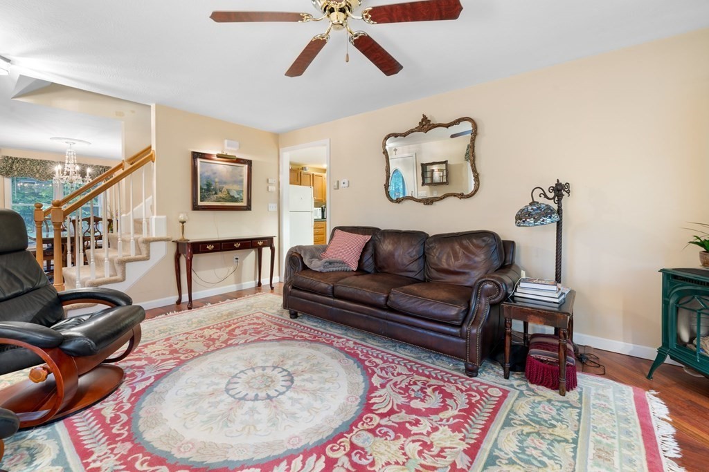235 Curtis Farm Road Wilton, NH 03086 - Photo 4 of 34 a living room with furniture and a wooden floor