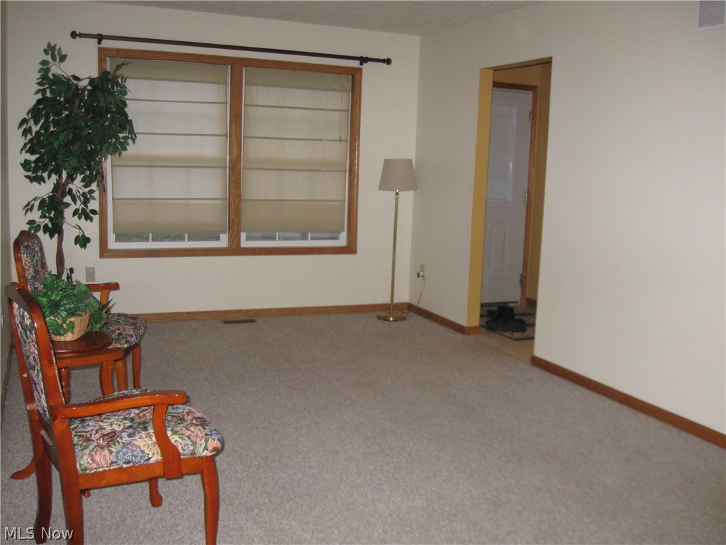 52 Beech Street Rittman, OH 44270 - Photo 25 of 35 Living room view looking toward front of house. Double windows in front bring in abundance of natural light.