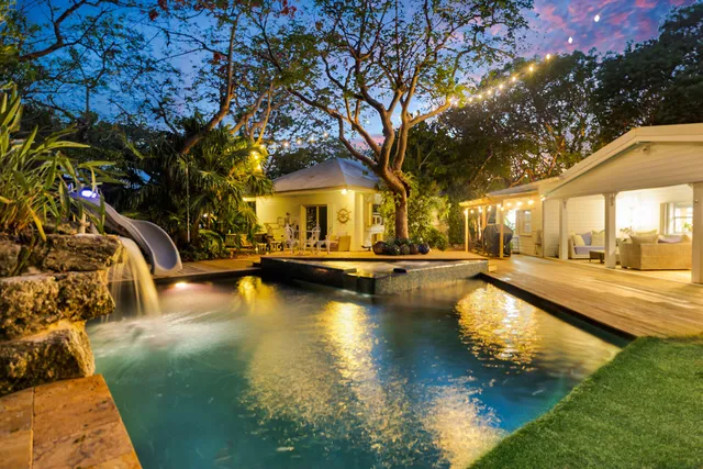 a view of a swimming pool with lounge chair