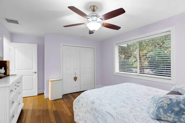 a en suite bathroom with a granite countertop double vanity sink a mirror and a shower