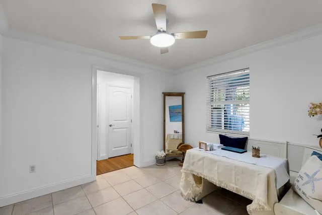 a view of a house with swimming pool and sitting area