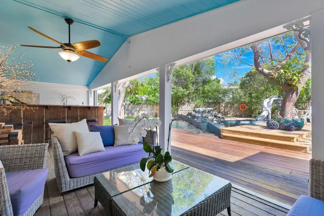 a view of a backyard with sitting area