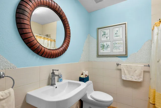 a wooden bench sitting in the middle of a yard