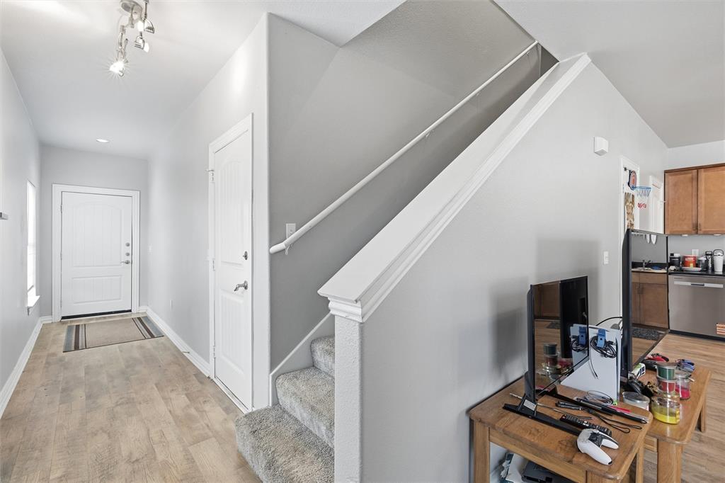2410 South 2nd Street, Unit 737 Waco, TX 76706 - Photo 12 of 40 front entryway, garage entry, stairway to bedrooms upstairs
