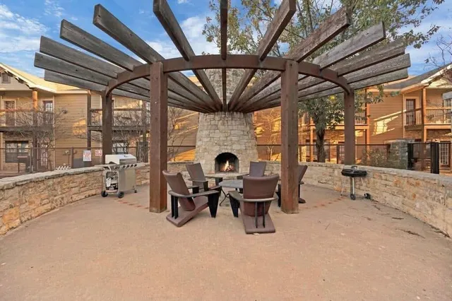 a view of a livingroom with furniture and a fireplace