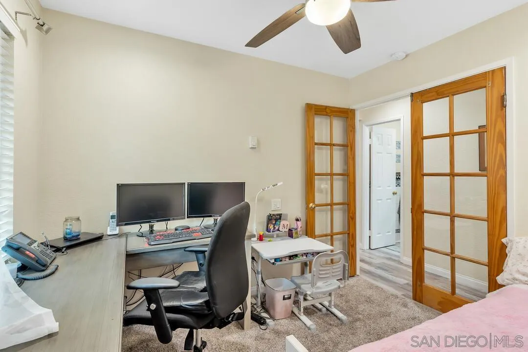 8683 Wahl Street Santee, CA 92071 - Photo 15 of 24 a view of a workspace with furniture and a window