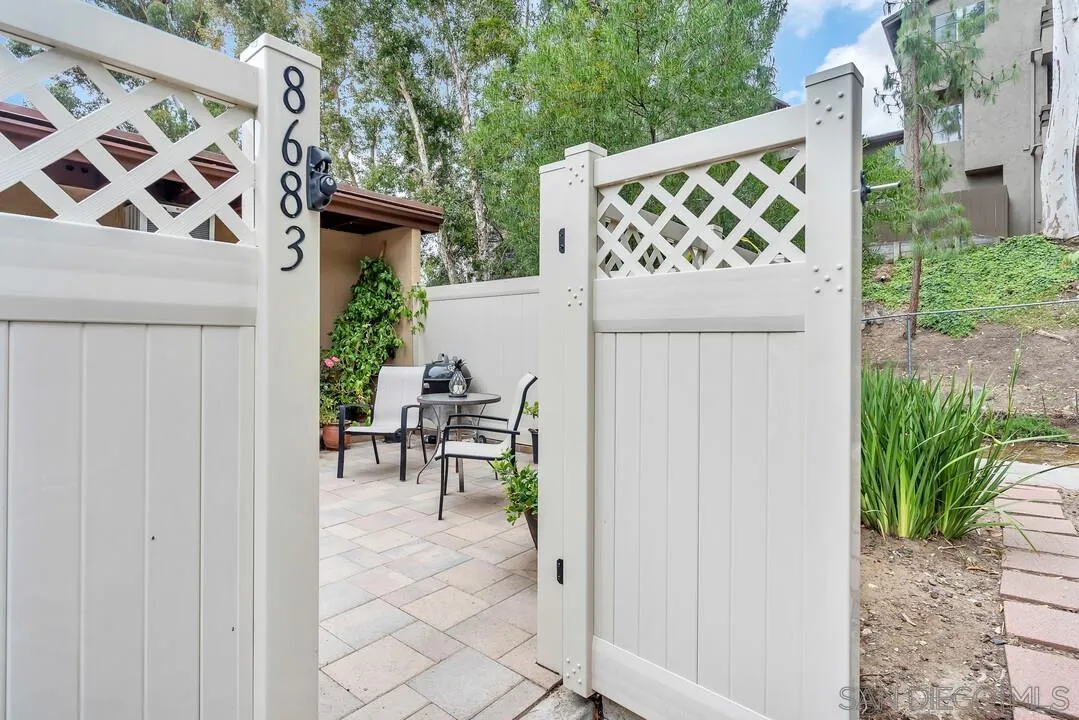 8683 Wahl Street Santee, CA 92071 - Photo 17 of 24 a white house with table and chairs