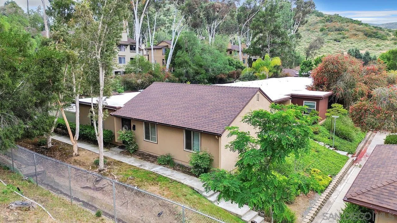 8683 Wahl Street Santee, CA 92071 - Photo 2 of 24 a view of a backyard with plants and a patio