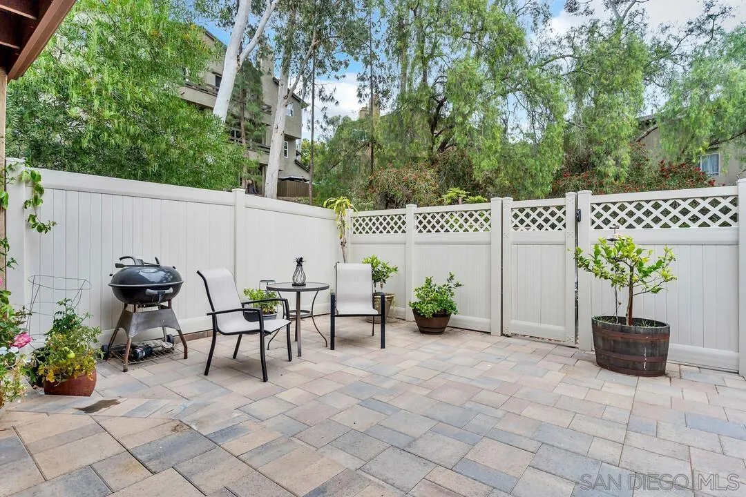 8683 Wahl Street Santee, CA 92071 - Photo 21 of 24 a view of a patio with a table and chairs and potted plants