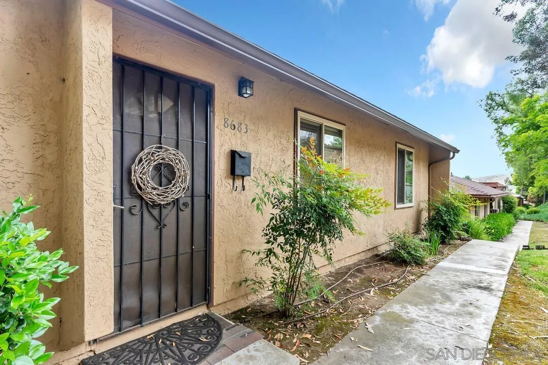 8683 Wahl Street Santee, CA 92071 - Photo 4 of 24 a front view of a house with garden