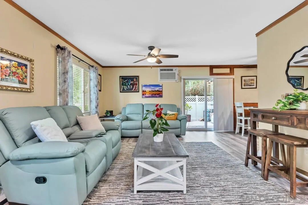 8683 Wahl Street Santee, CA 92071 - Photo 5 of 24 a living room with furniture and a chandelier