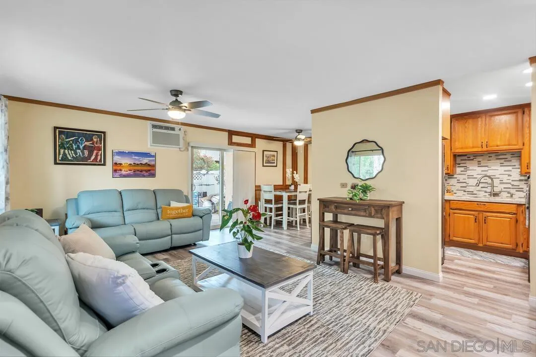 8683 Wahl Street Santee, CA 92071 - Photo 7 of 24 a living room with furniture and wooden floor