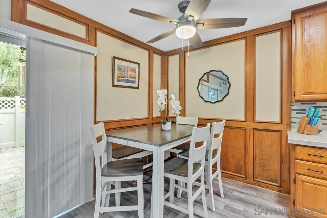 8683 Wahl Street Santee, CA 92071 - Photo 8 of 24 a view of a dining room with furniture window and wooden floor