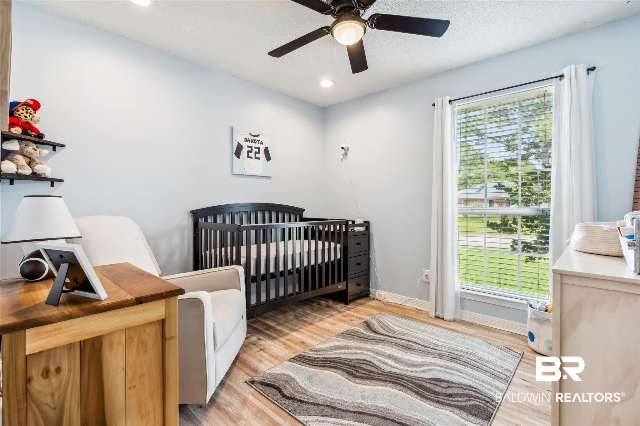 9306 Prairie Drive Semmes, AL 36575 - Photo 13 of 20 Bedroom featuring a nursery area, ceiling fan, and light wood-type flooring