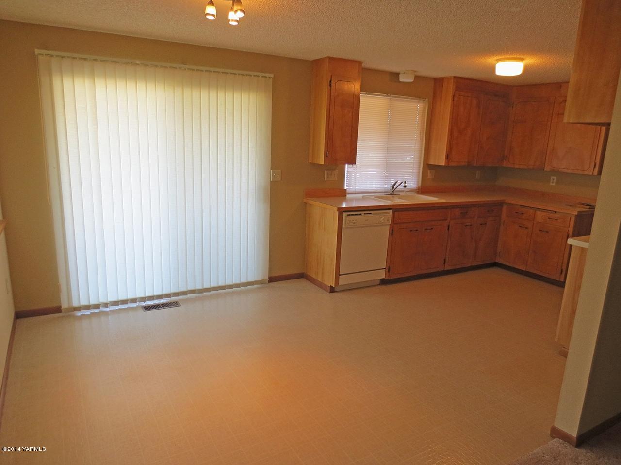 172 Kail Road Tieton, WA 98947 - Photo 9 of 16 a room with a window and a kitchen