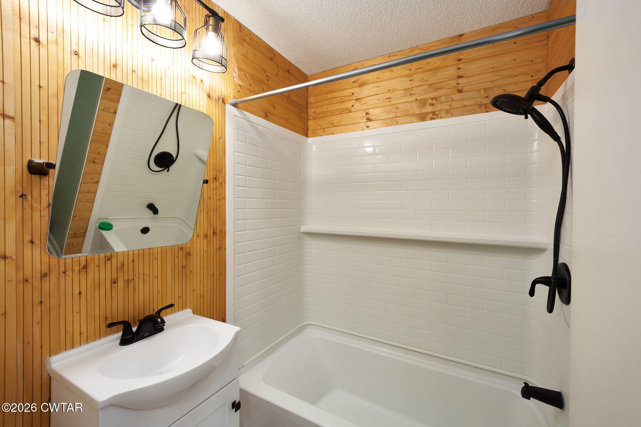 306 Jim Jackson Road Humboldt, TN 38343 - Photo 20 of 29 a bathroom with a sink a glass door shower and a mirror