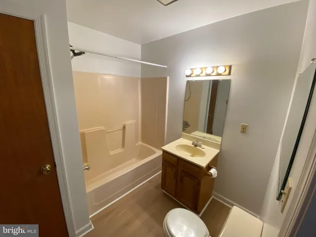 a bathroom with a sink toilet tub and shower