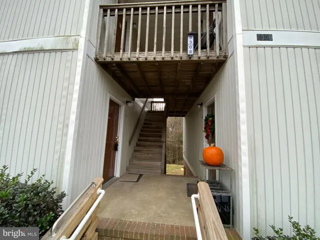 a view of a balcony with wooden floor