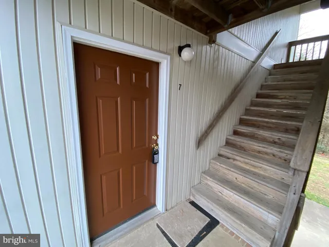 a view of entryway with wooden floor