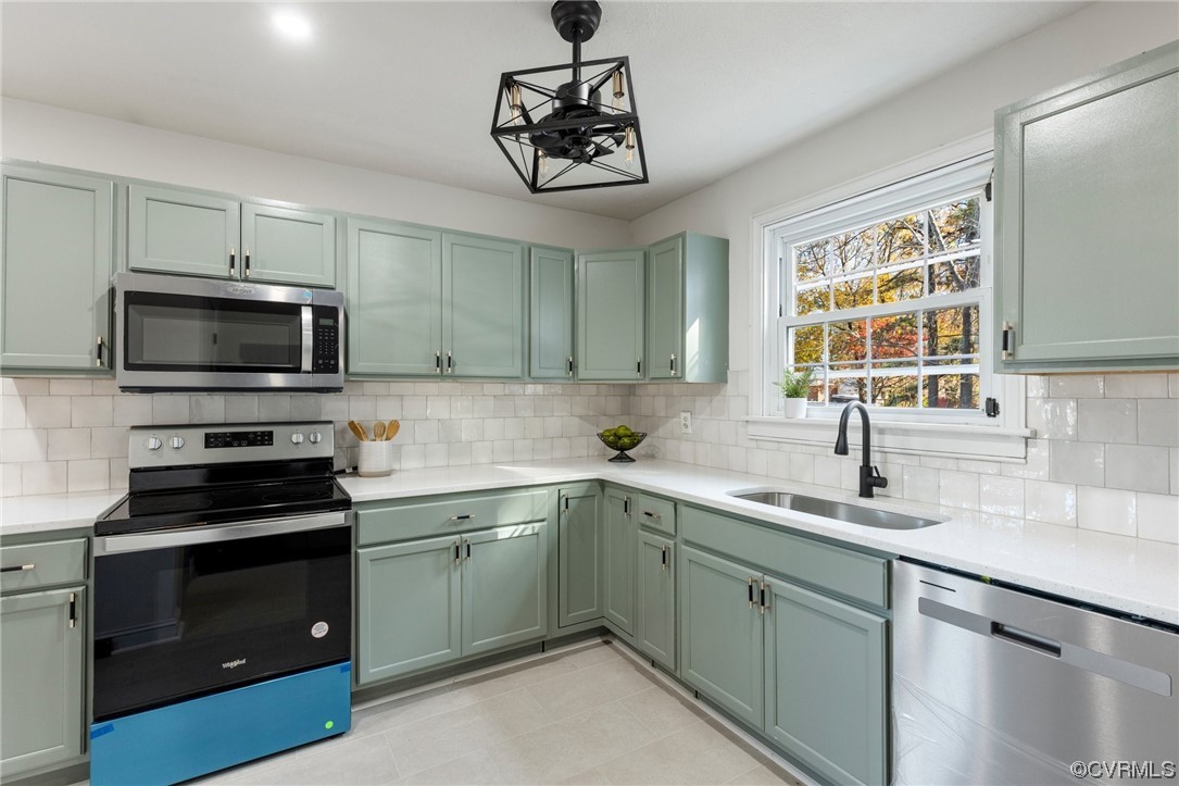 2535 Fort Lee Road Petersburg, VA 23805 - Photo 13 of 26 a kitchen with a sink stainless steel appliances and a window