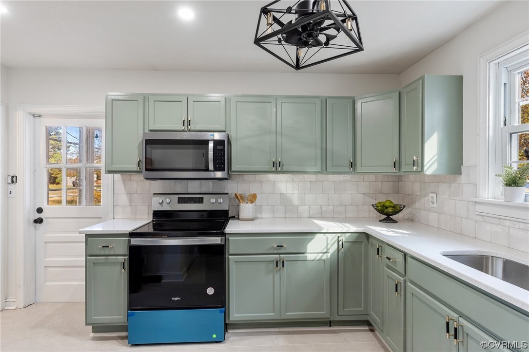 2535 Fort Lee Road Petersburg, VA 23805 - Photo 15 of 26 a kitchen with a sink and a stove top oven