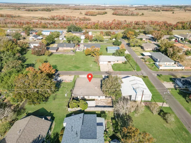 an aerial view of residential houses with outdoor space