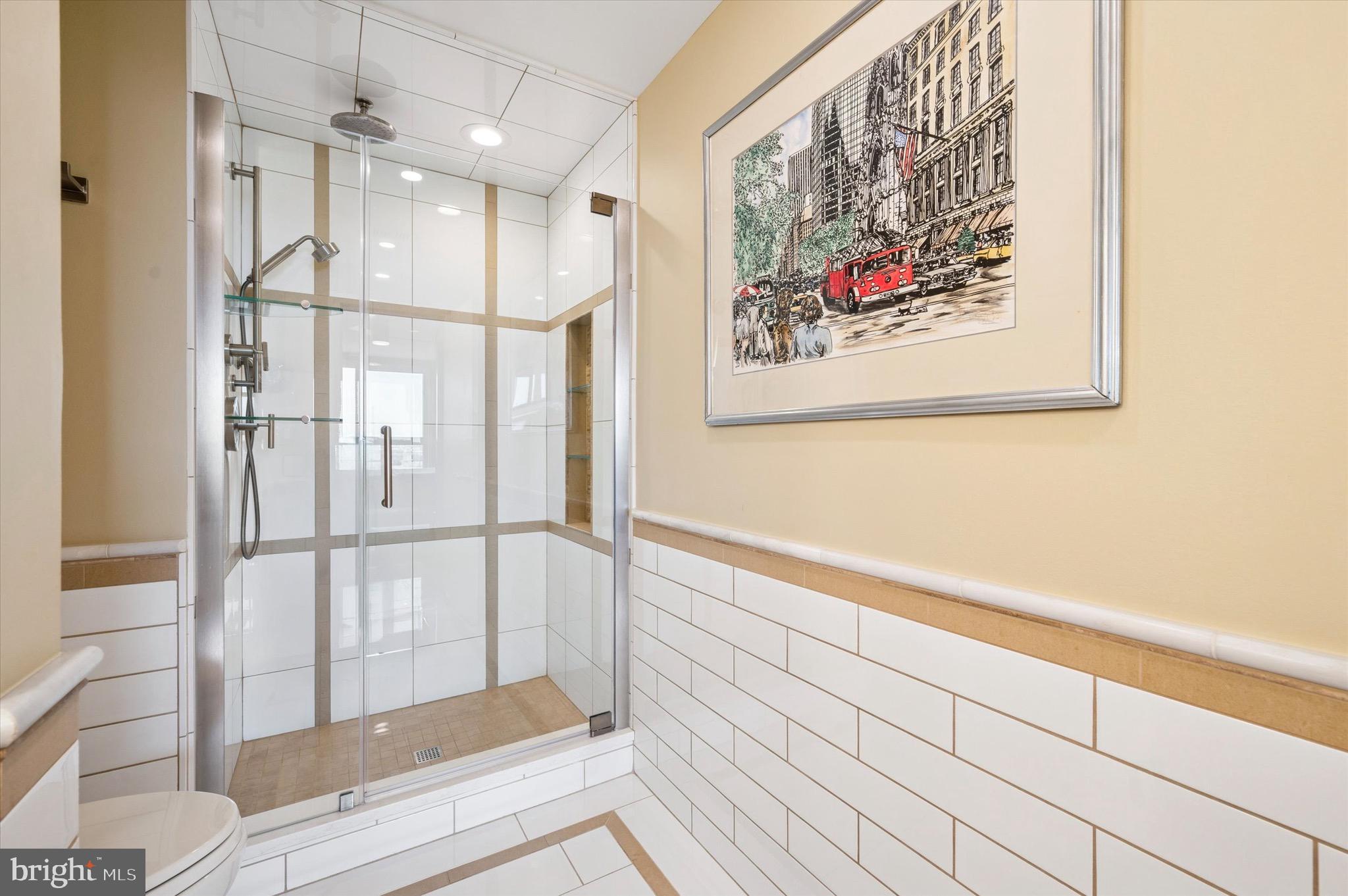 717 South Christopher Columbus Boulevard, Unit 802 Philadelphia, PA 19147 - Photo 19 of 32 a bathroom with a bathtub and a shower