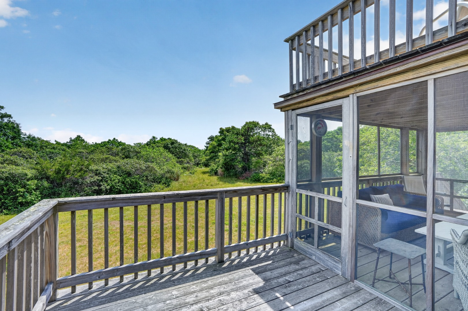 28 Black Point Road Chilmark, MA 02535 - Photo 40 of 56 Deck wraps around the whole house.