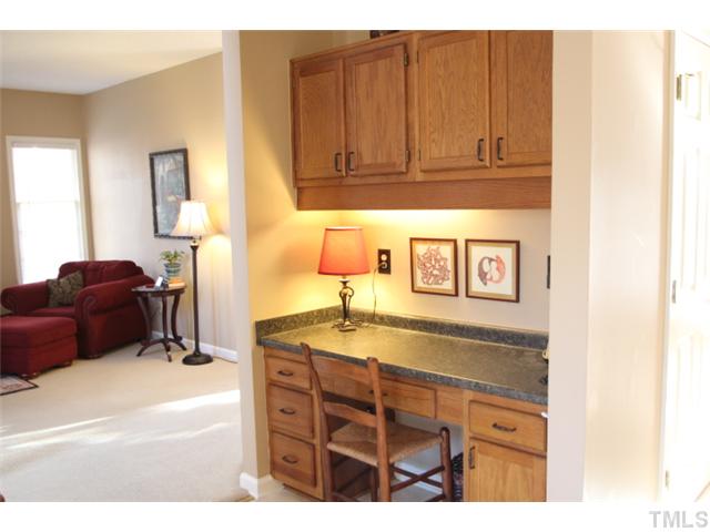 12108 North Exeter Way Raleigh, NC 27613 - Photo 7 of 19 a kitchen with a sink and cabinets