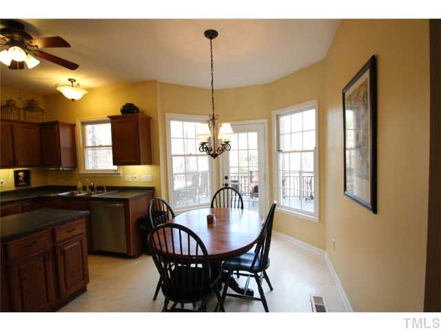 12108 North Exeter Way Raleigh, NC 27613 - Photo 8 of 19 a dining room with furniture and window