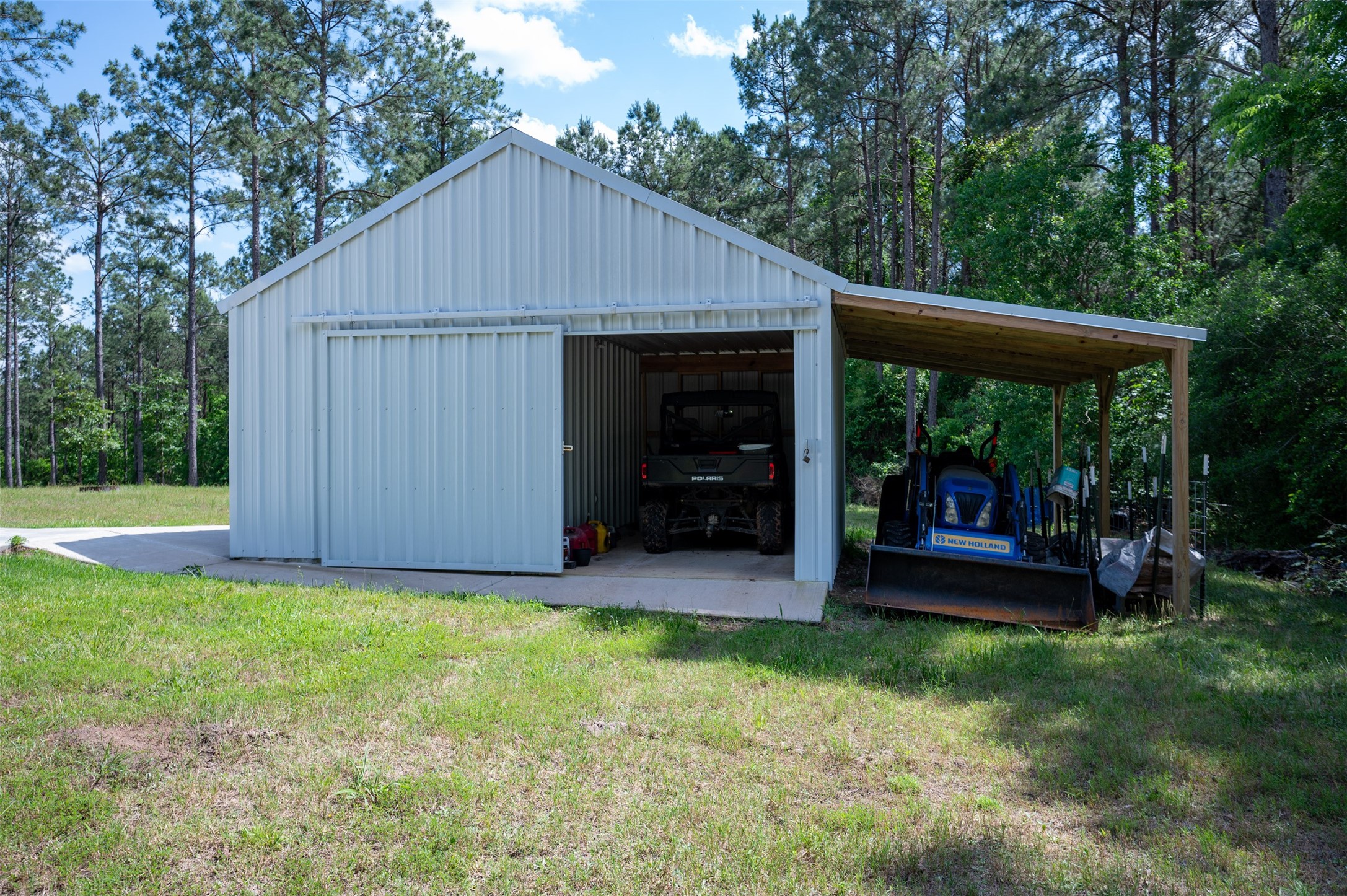 1068 County Road 3200 Colmesneil, TX 75938 - Photo 36 of 43 a backyard of a house with table and chairs