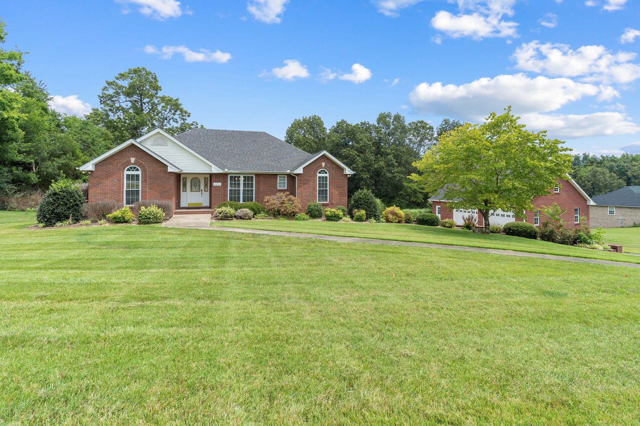 3851 Springdale Road Cunningham, TN 37052 - Photo 1 of 33 a front view of a house with a garden
