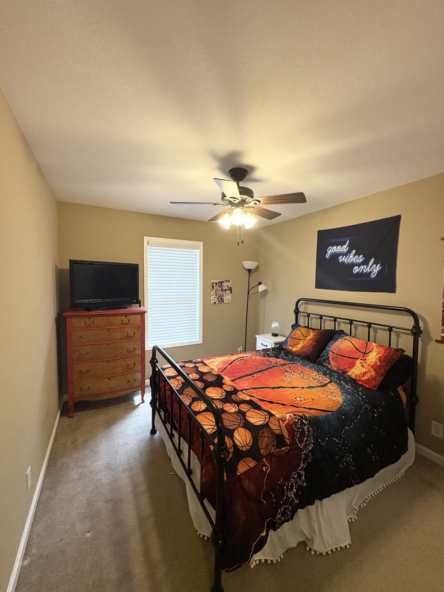 3851 Springdale Road Cunningham, TN 37052 - Photo 18 of 33 a bedroom with a bed and a chandelier