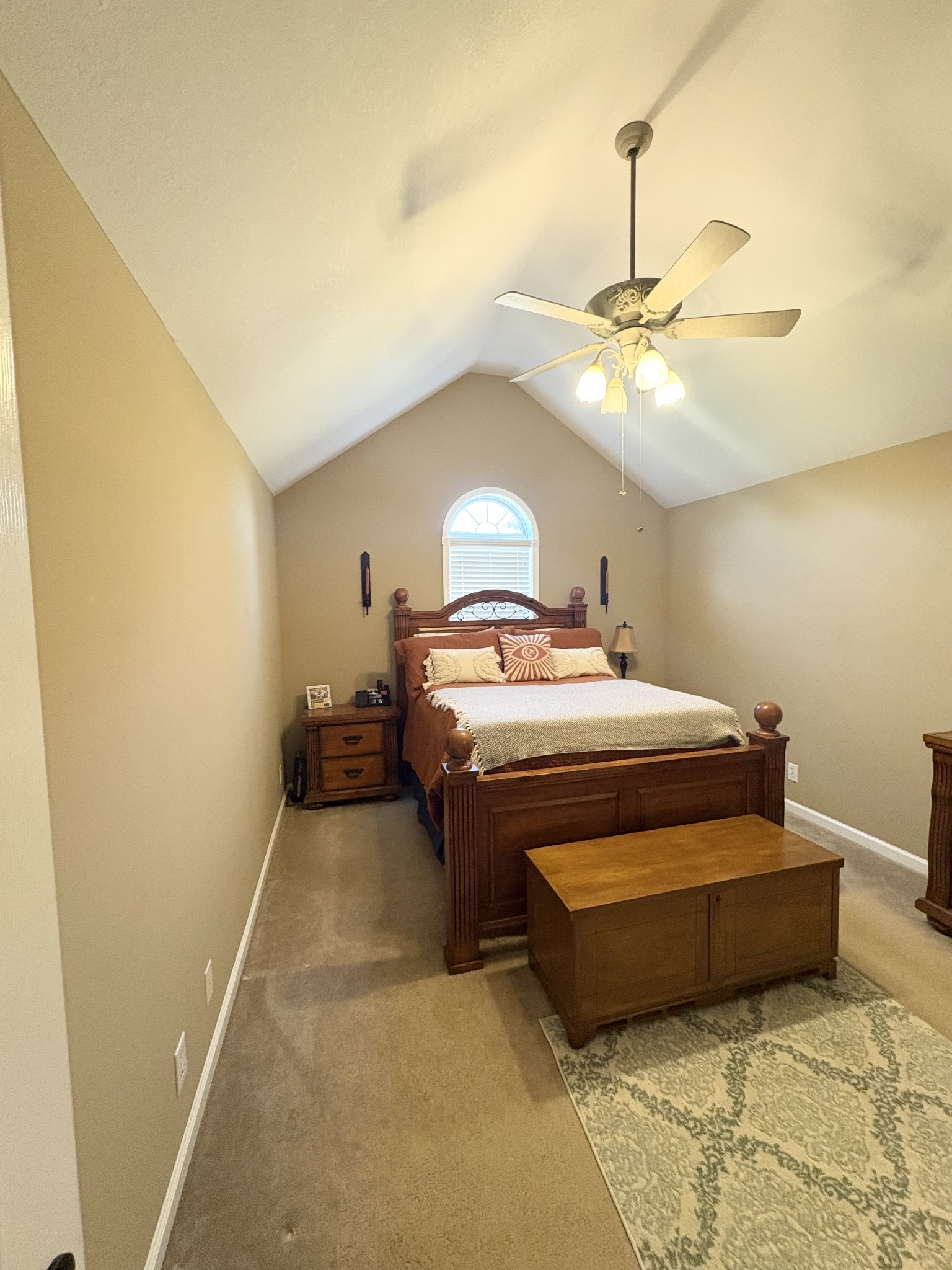 3851 Springdale Road Cunningham, TN 37052 - Photo 9 of 33 a bedroom with a bed and a chandelier
