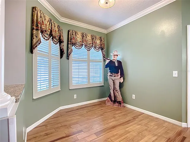 a view of a room with gym equipment and a window