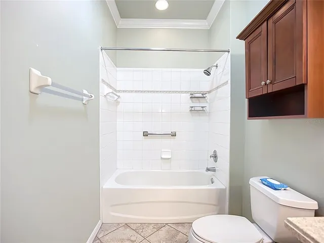 a bathroom with a toilet and a bathtub