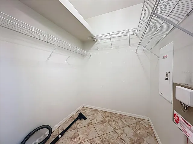 a view of storage and utility room with empty racks